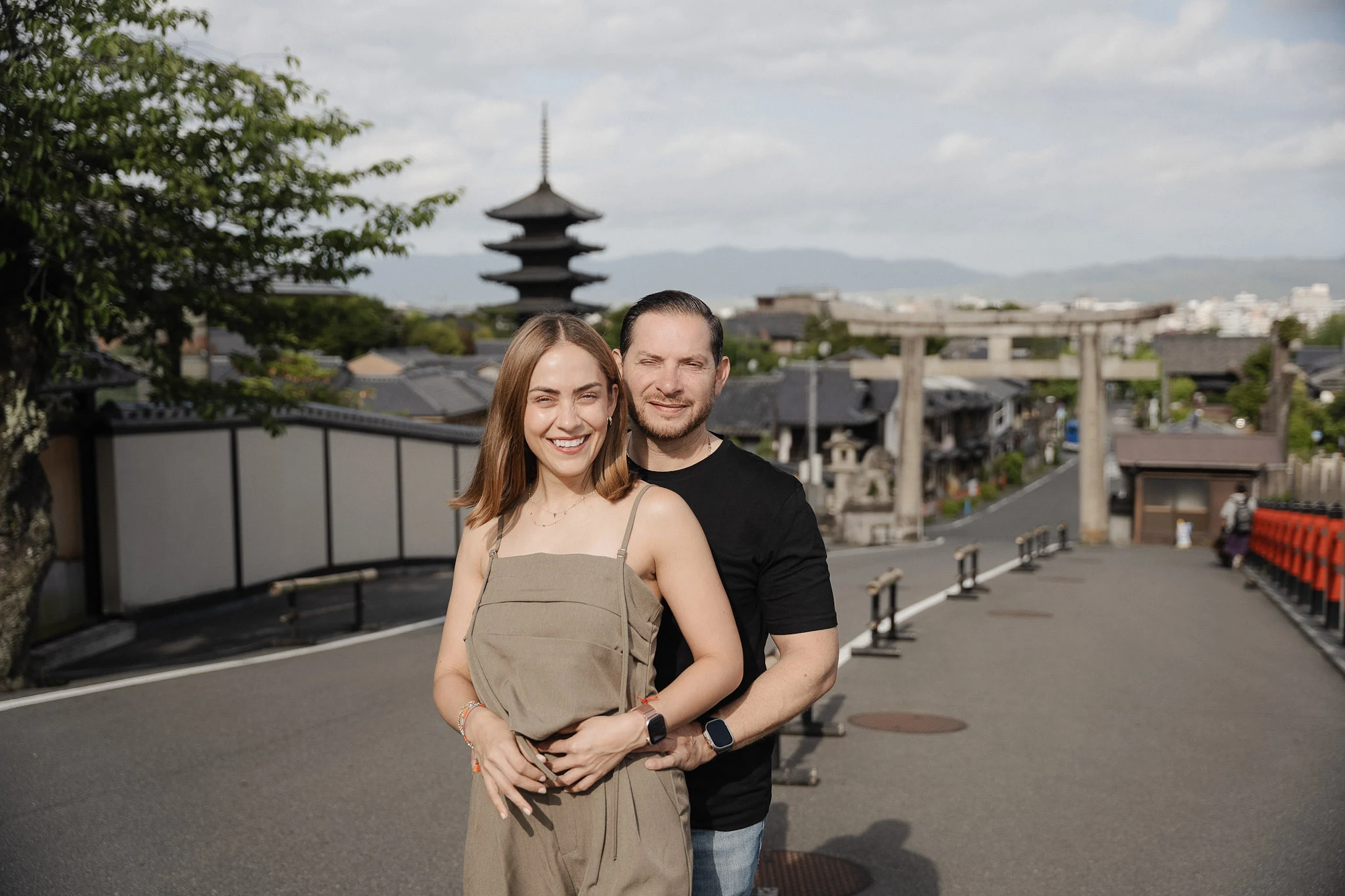 Couple smiling with Yasaka Pagoda in the background in Kyoto